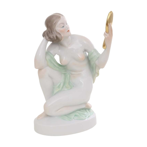 Nude woman with mirror